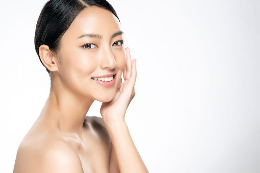 Beautiful Young Asian Woman with Clean Fresh Skin touch own face, Facial treatment, Cosmetology, beauty and spa,