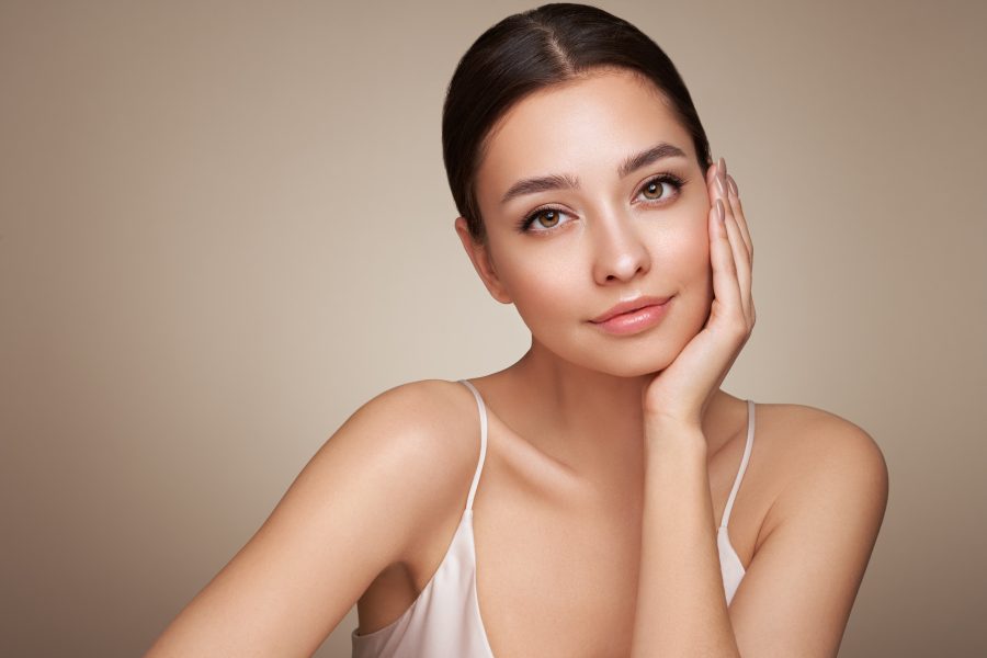Portrait beautiful young woman with clean fresh skin. Model with healthy skin, close up portrait. Cosmetology, beauty and spa